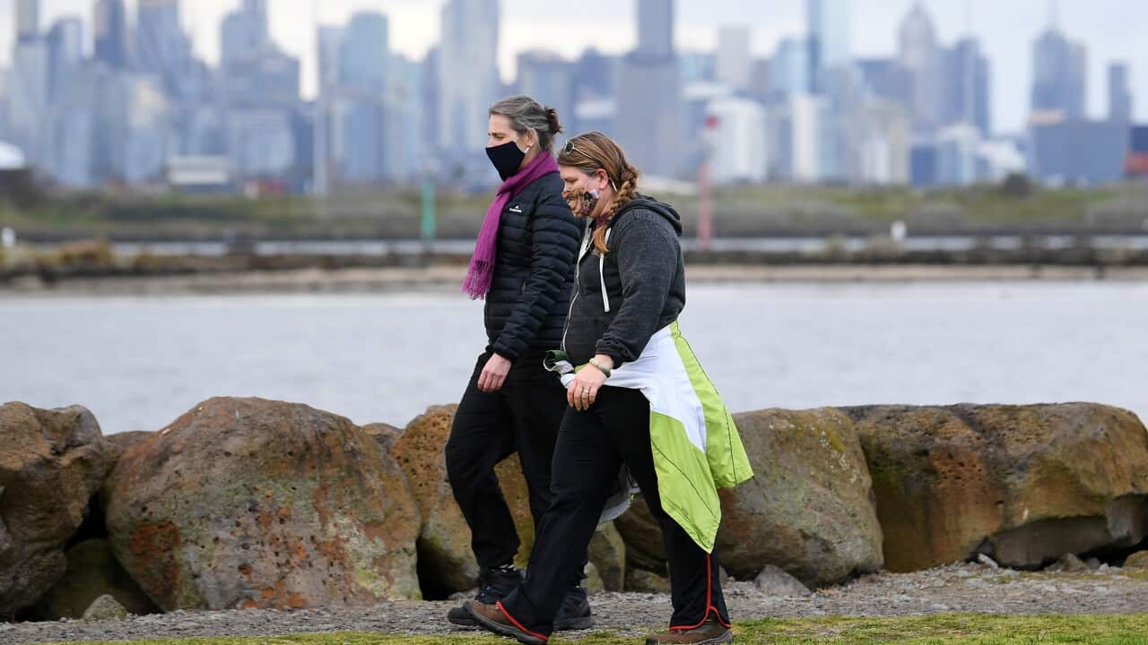 People wearing face masks are seen in Melbourne, Sunday, August 29, 2021. Victoria has recorded 92 new cases of locally acquired Covid19 in the past 24 hours. (AAP Image/James Ross) NO ARCHIVING