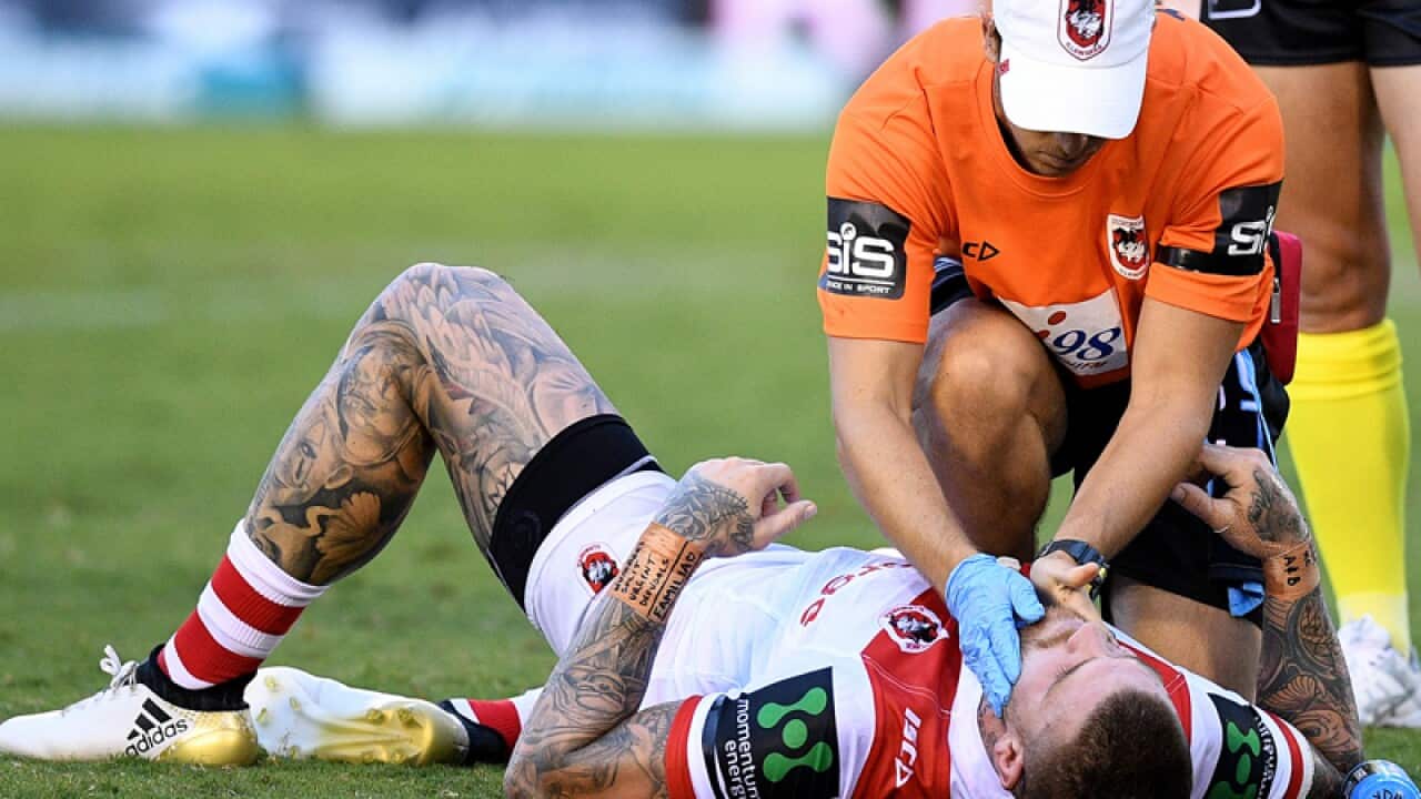 St George Illawarra fullback Josh Dugan receives medical attention