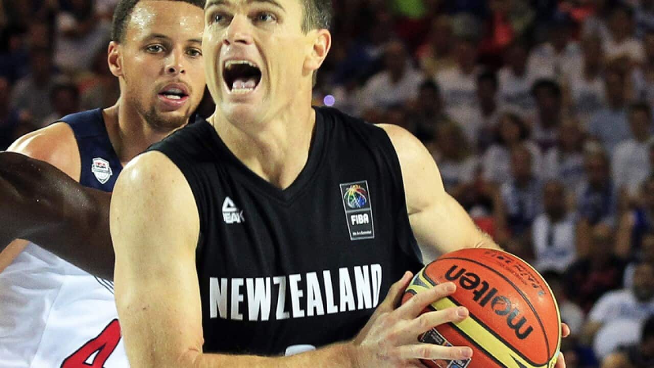 Kirk Penney (R) of New Zealand