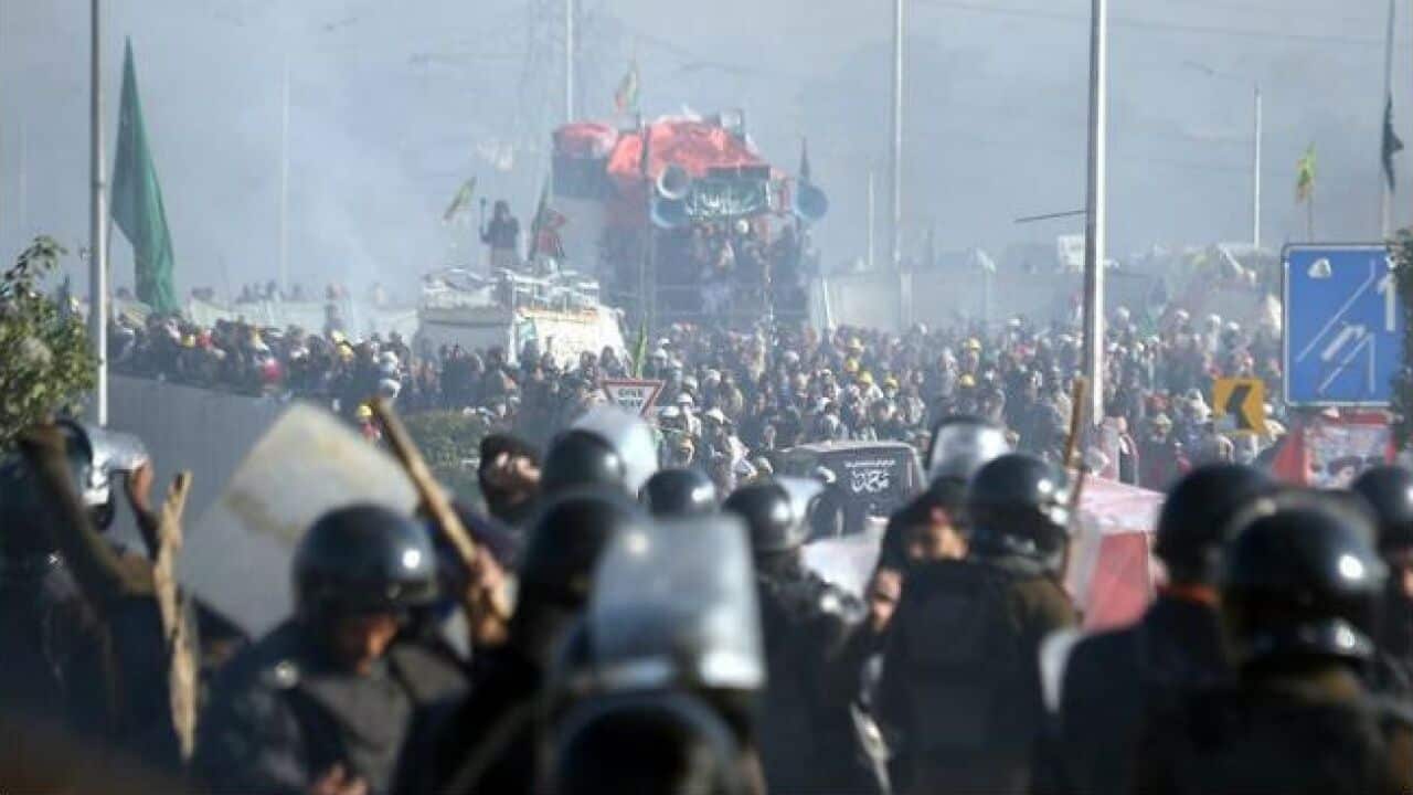 Pakistani security officials clash with supporters of religious group Tehrik Labayk Ya Rasool Allah in Islamabad, Pakistan.