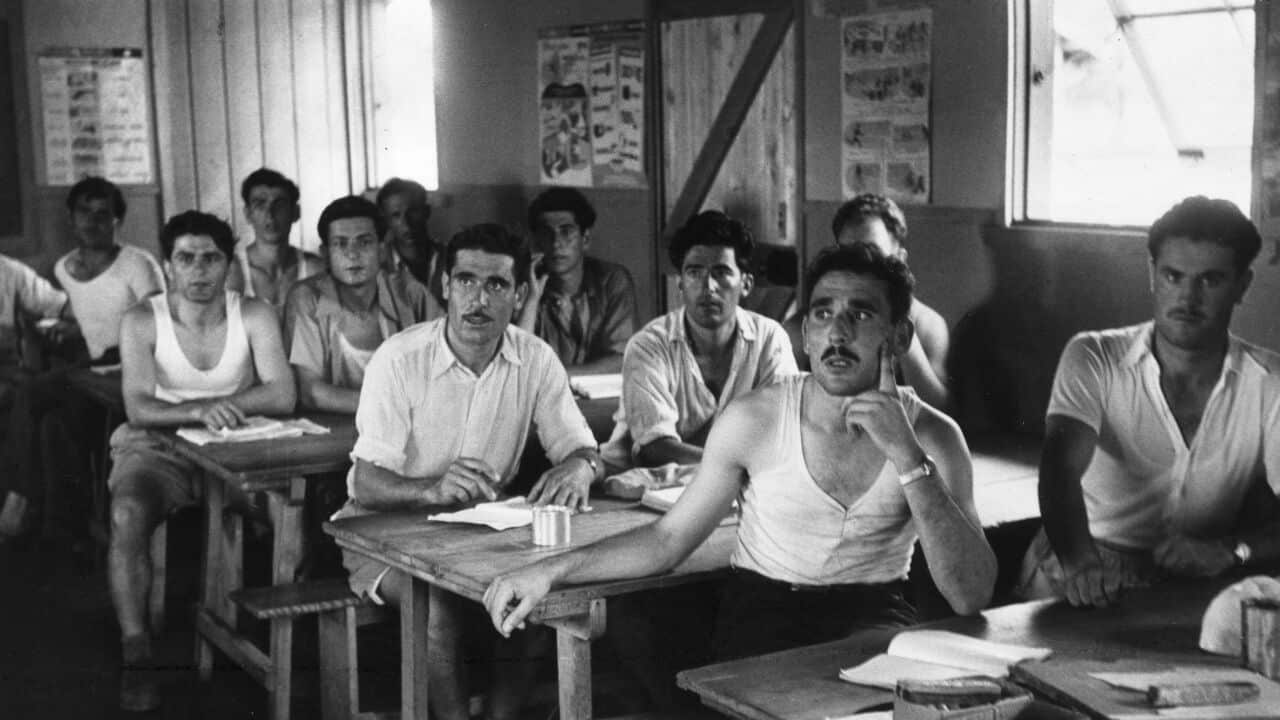June 1954:  Greek immigrants to Australia attend English language lessons at the Bonnegilla Reception Centre near Alderbury, Victoria.