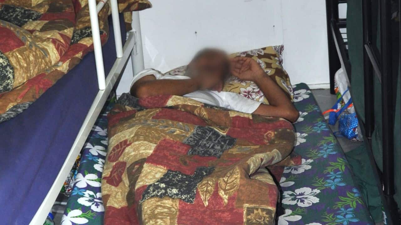 An asylum seeker sleeping on the floor at Manus AAP.jpg