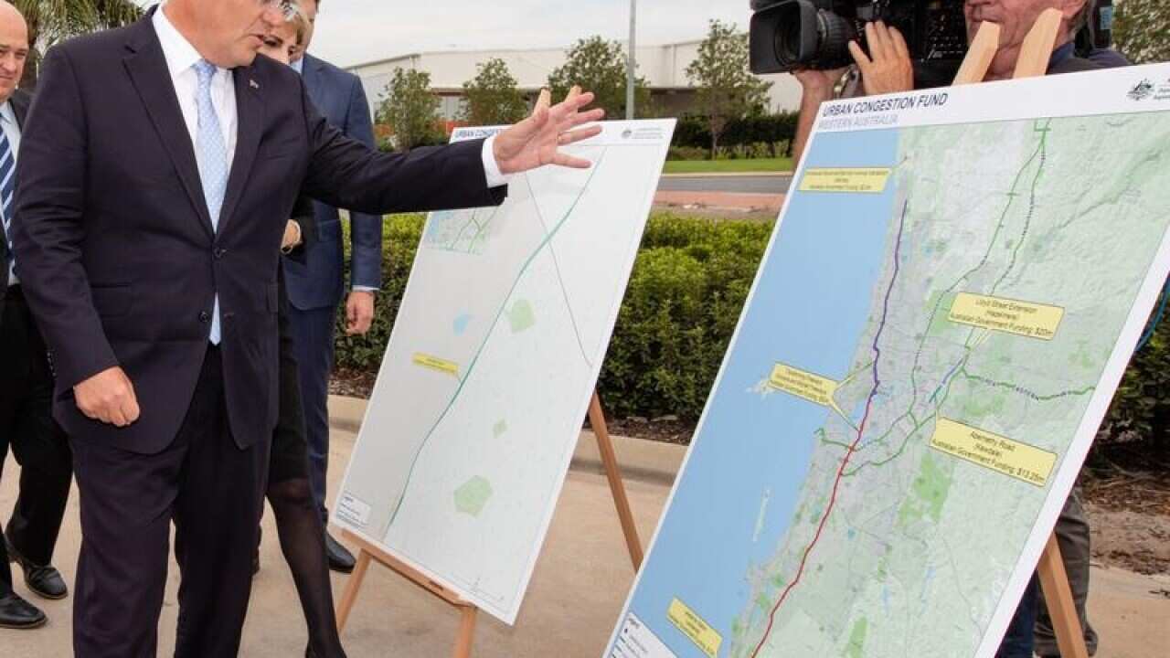 Prime Minister Scott Morrison looks at road decongestion plans.
