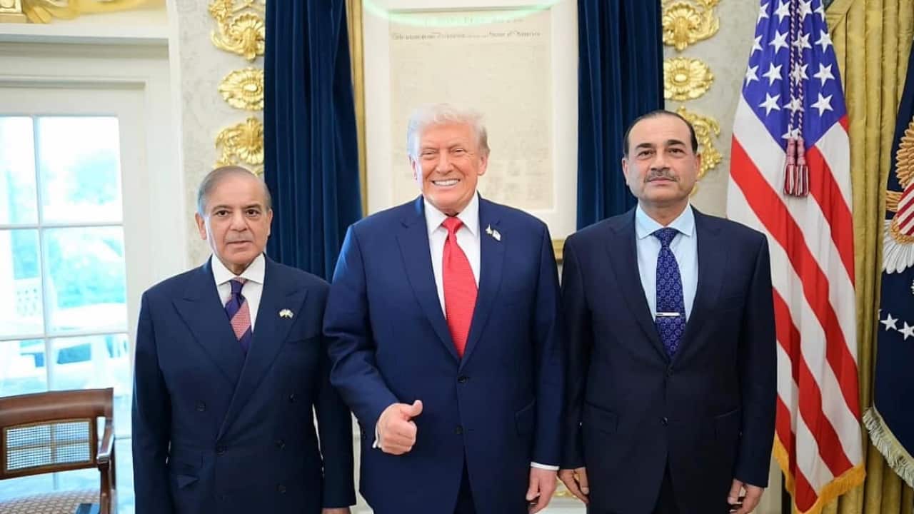 three men wearing suit posing in front of camera