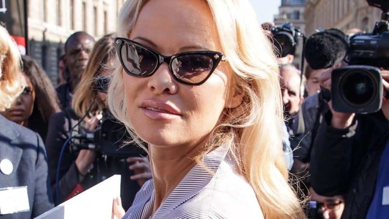 Pamela Anderson in front of the press at a animal rights protest,