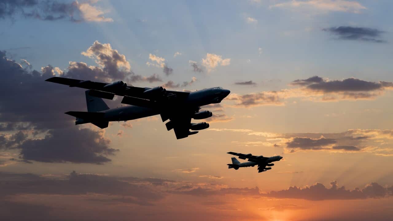 B-52 Bomber Airplanes flying at sunset