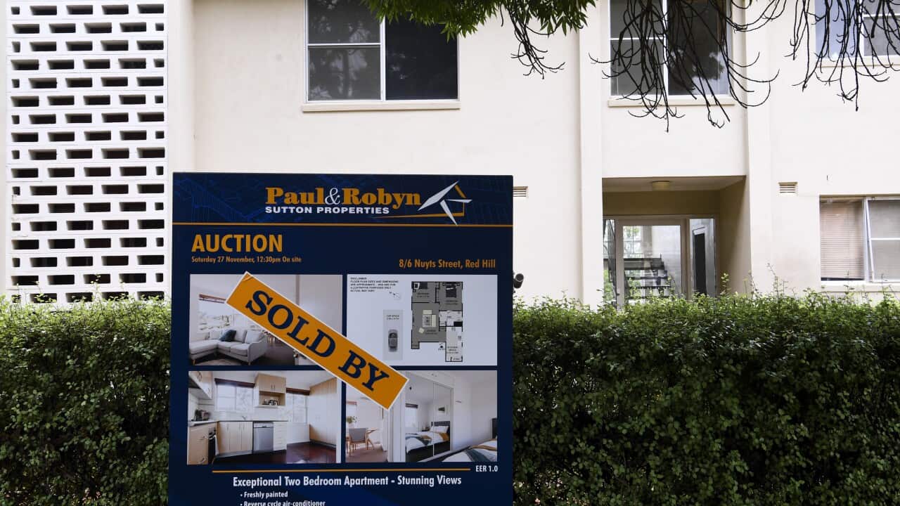 A ’SOLD’ sign is seen outside an apartment block in Canberra.
