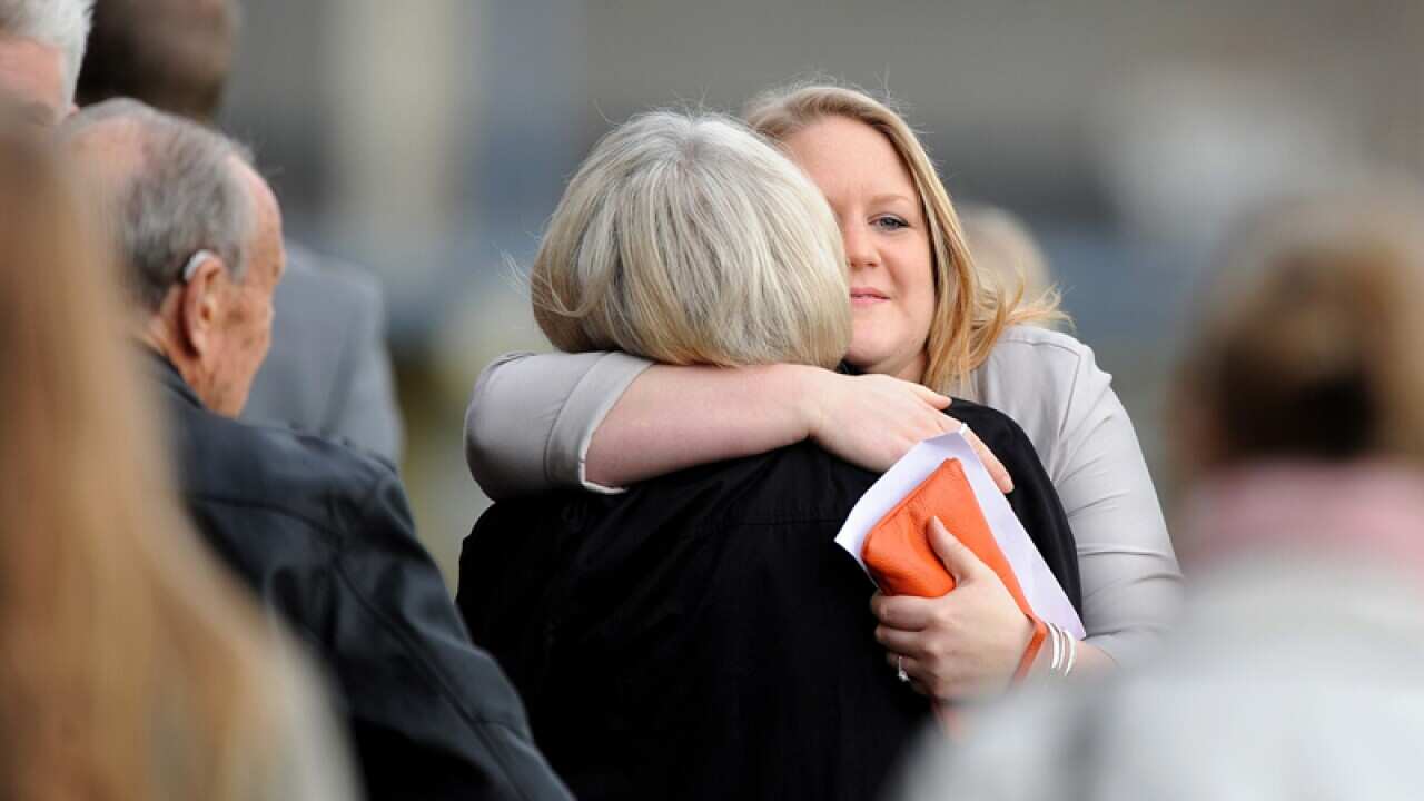 Friends and family pay their respects to victims of flight MH17.