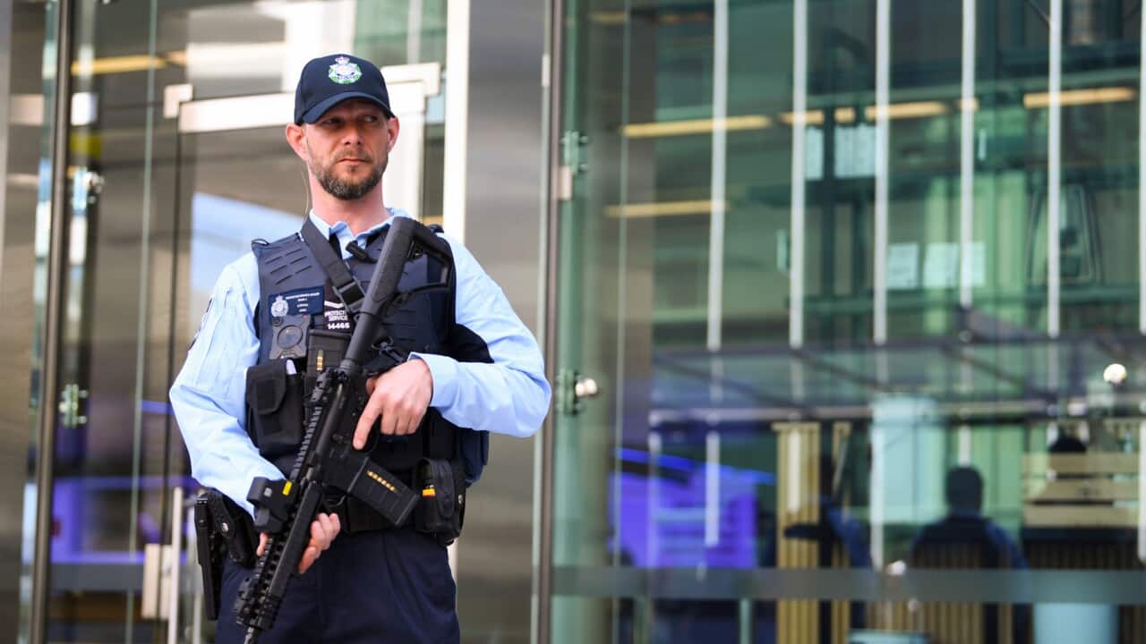 An AFP officer holds a Mk18 Rifle during an announcement by Scott Morrison to increase counter-terrorism measures