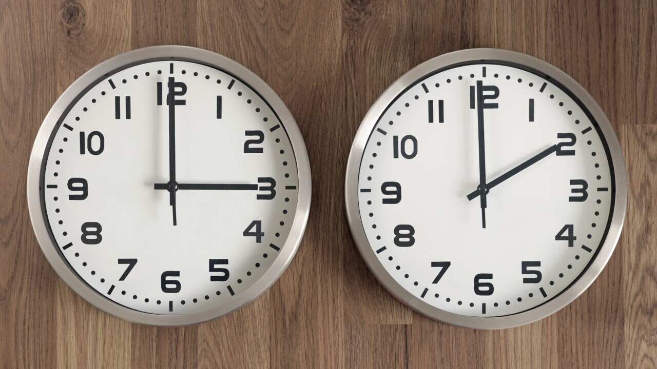 Two clocks, one showing three o'clock, the other showing two o'clock