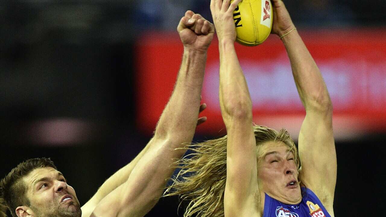 Western Bulldogs defender Roarke Smith (R)