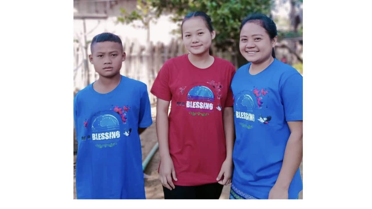 Naw Ta Kaw Say with her younger sister and brother.