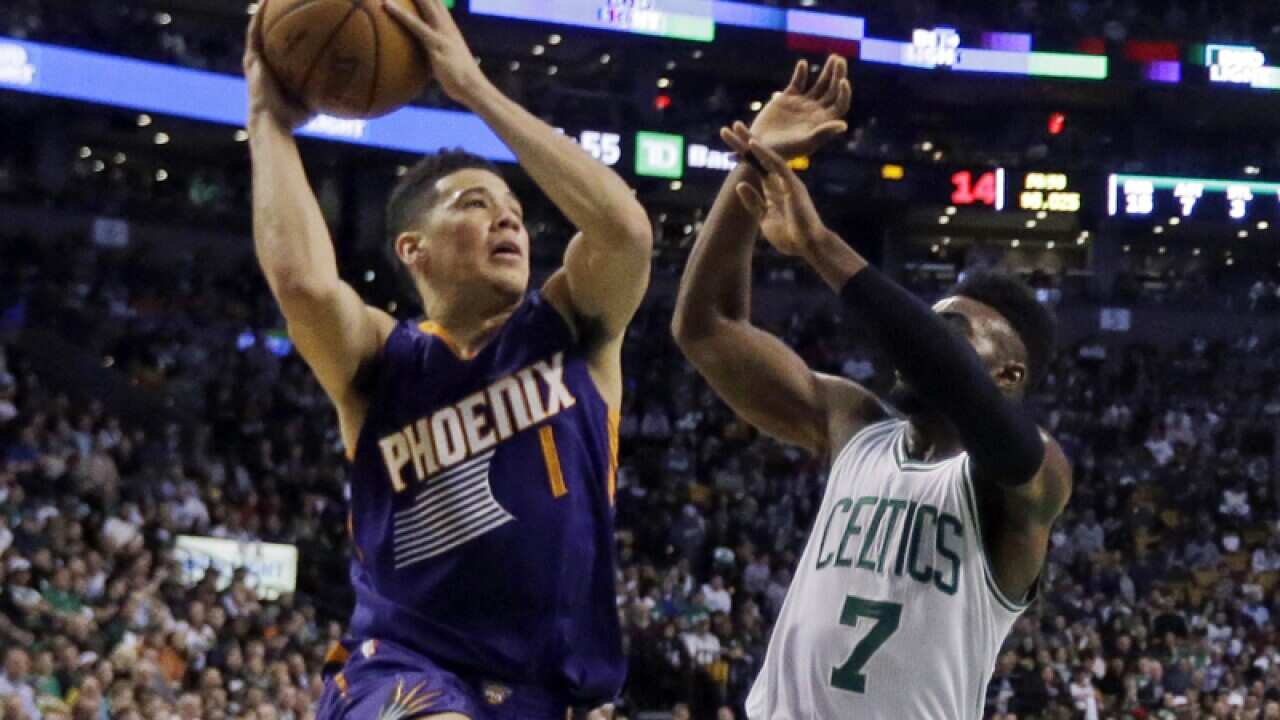 Phoenix Suns Devin Booker (1), Boston Celtics Jaylen Brown (7)