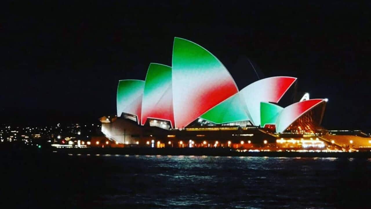 The sails of the Opera House illuminated with the colors of the Italian flag on 2 June 2021