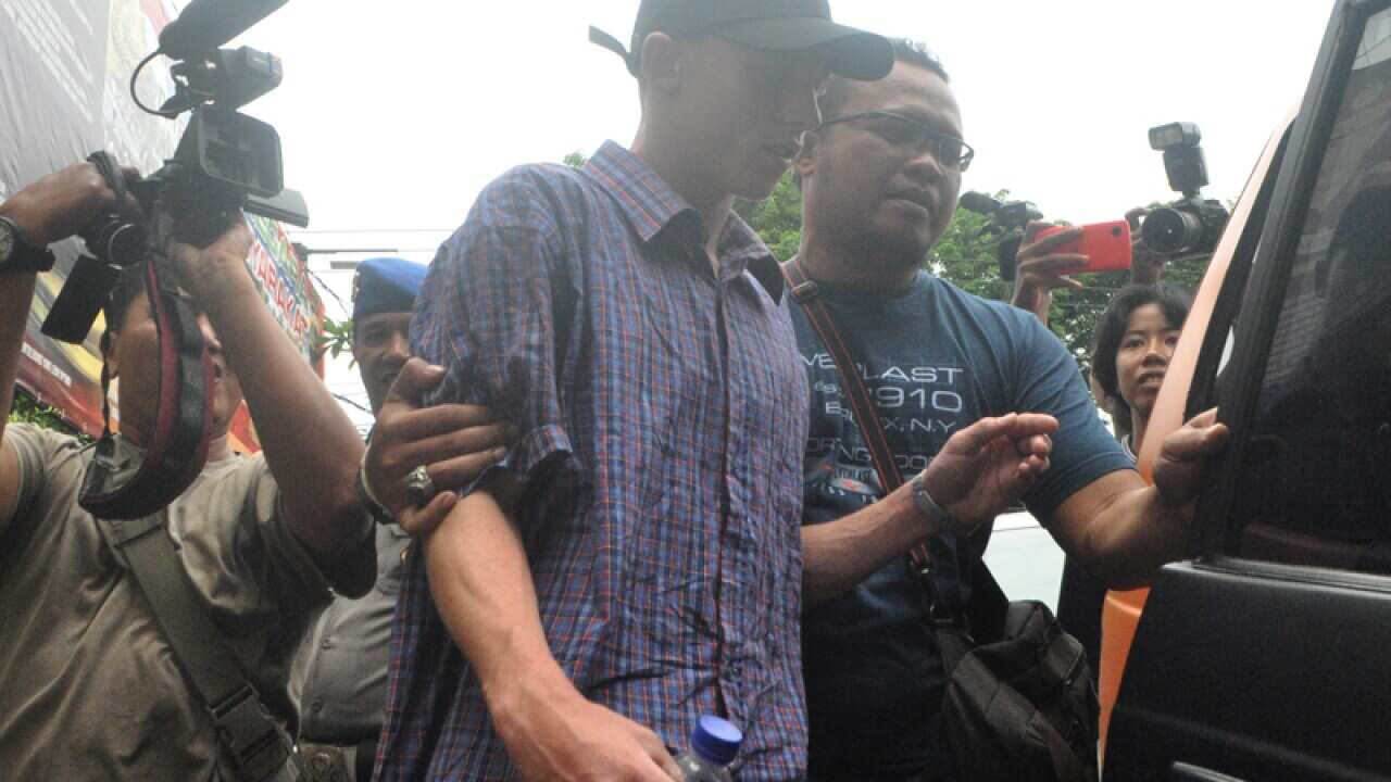 Australian teenager Jamie Murphy is escorted at Kuta police station