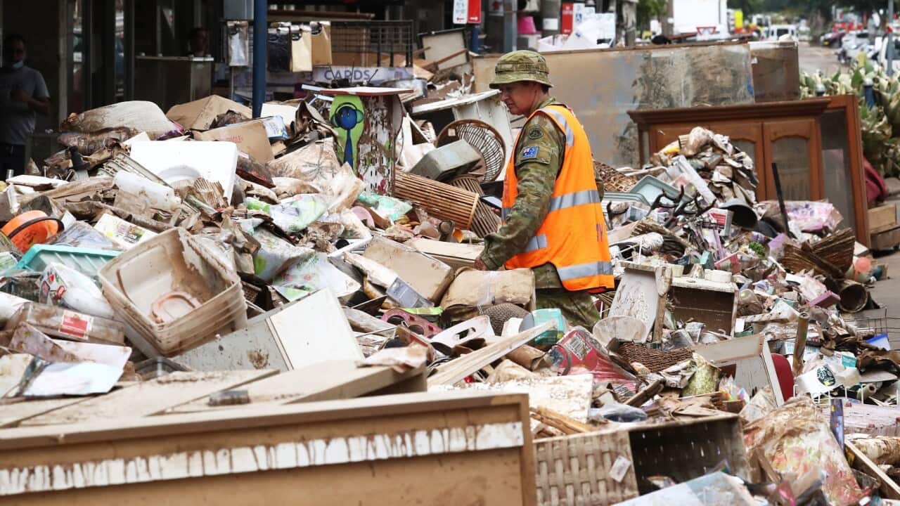 Australian Defence Force Personel assist with the clean up after the floods in the Central Business District of Lismore, NSW, Friday, March 4, 2022. (AAP Image/Jason O'Brien) NO ARCHIVING
