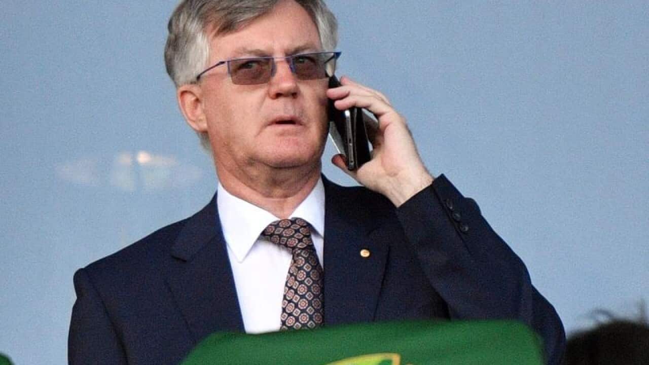 Martin Parkinson on his phone.