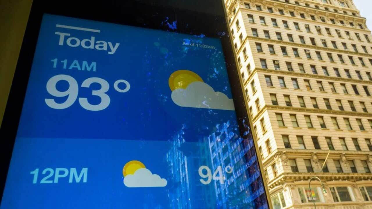 A LinkNYC street kiosk displays the temperature