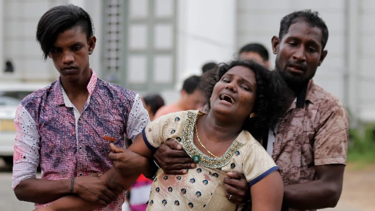 Relatives of a blast victim grieve outside a morgue in Colombo, Sri Lanka, Sunday, April 21, 2019.