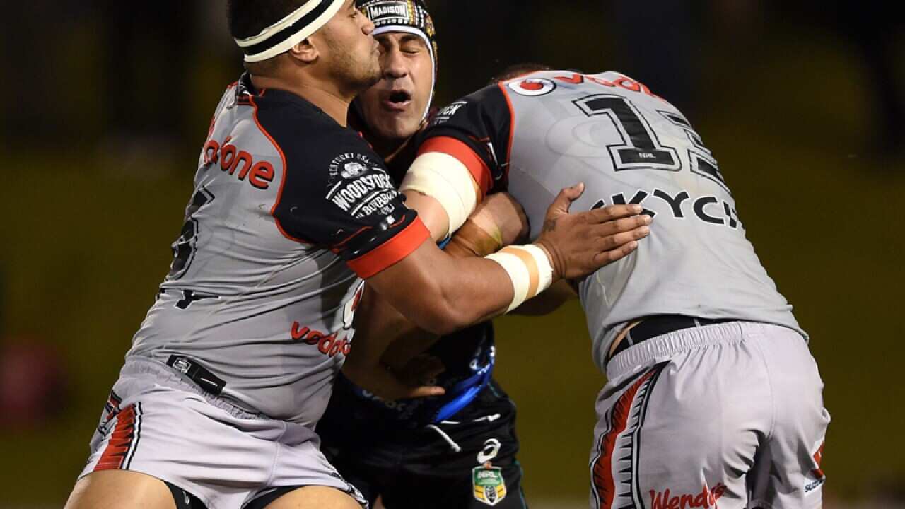 Penrith's Jamie Soward is tackled by NZ Warriors players