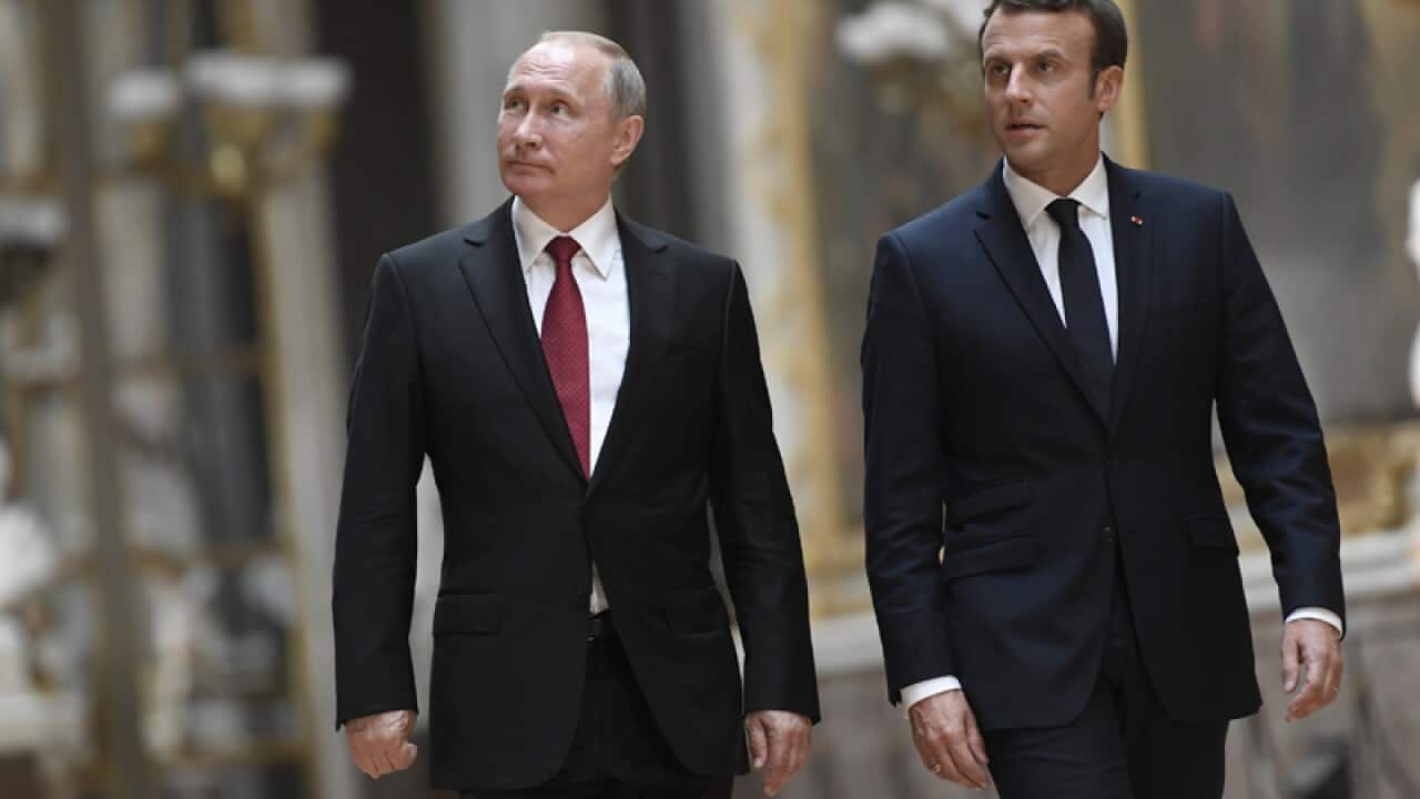 Emmanuel Macron and Vladimir Putin