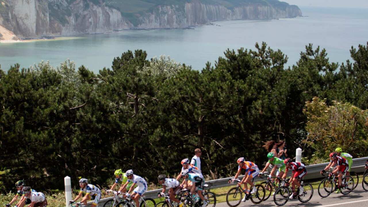 The pack rides past cliffs at Dieppe, a French port city on the English Channel, during stage four of the 2012 Tour de France. (Getty Images)