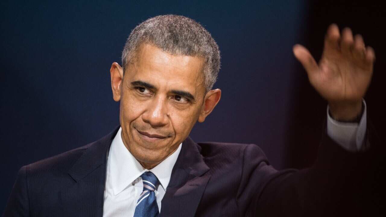 Former US President Barack Obama delivers speech at conference during his first visit to France since he left The White House in Paris on December 2, 2017.