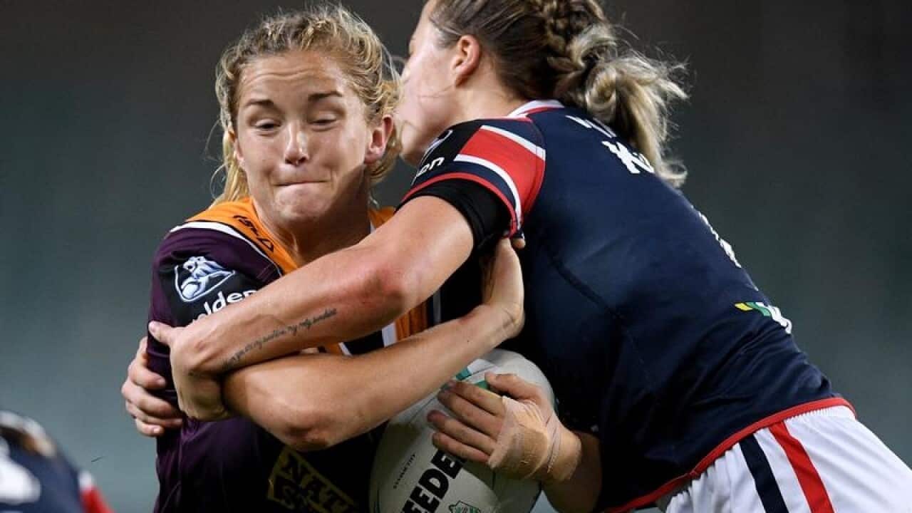 File image of Meg Ward of the Broncos tackled by Isabelle Kelly.