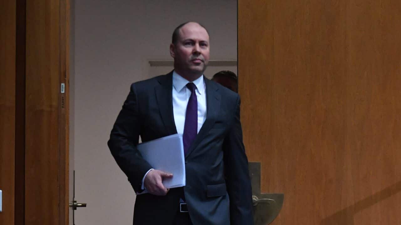 Treasurer Josh Frydenberg arrives to address the media during a federal budget update, ahead of the 2020/21 budget scheduled for October, at Parliament House in Canberra, Thursday, July 23, 2020. (AAP Image/Mick Tsikas) NO ARCHIVING
