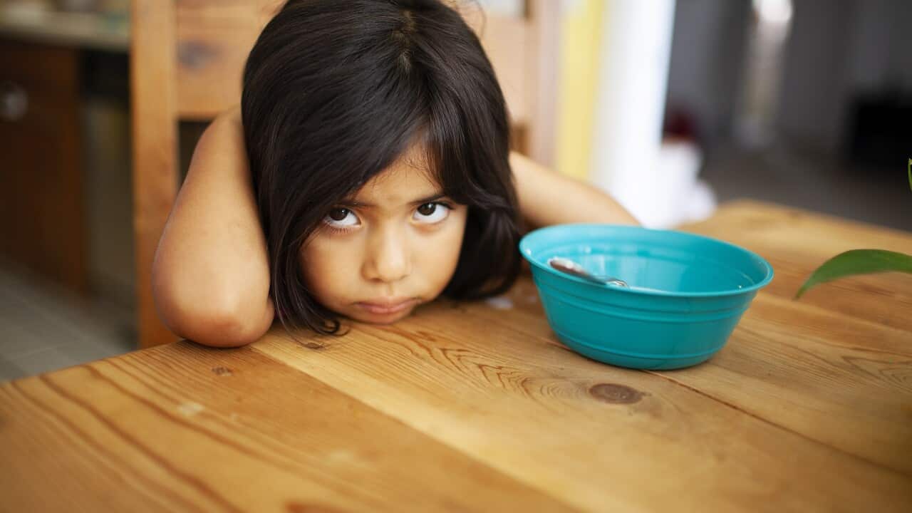 Girl Upset at Kitchen Table