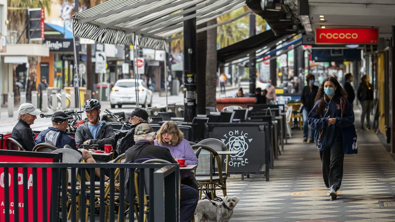 People are seen having a coffee St Kilda, Melbourne