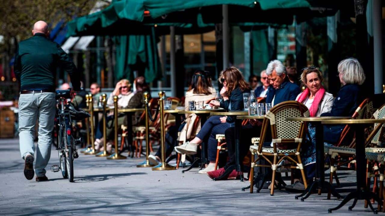 People sit in a restaurant in Stockholm.