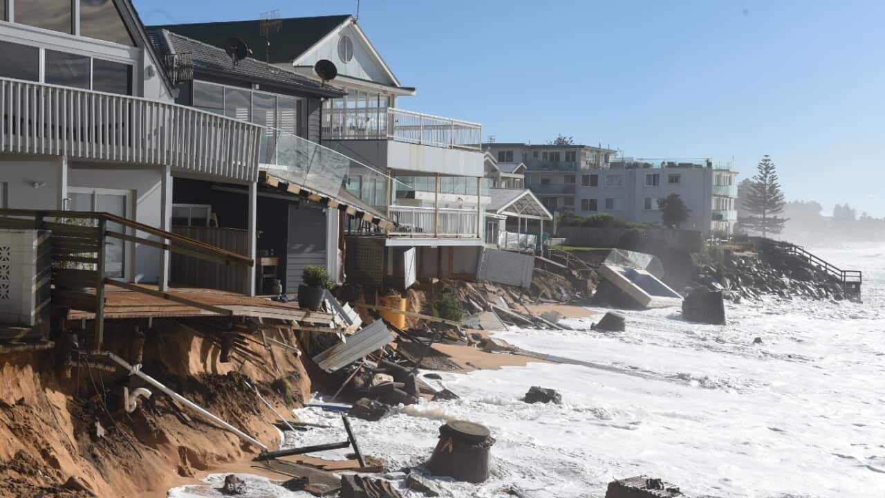 High tide begins to impact on damaged beachfront homes along Pittwater Road at Collaroy on the northern beaches of Sydney, Tuesday, June 7, 2016.