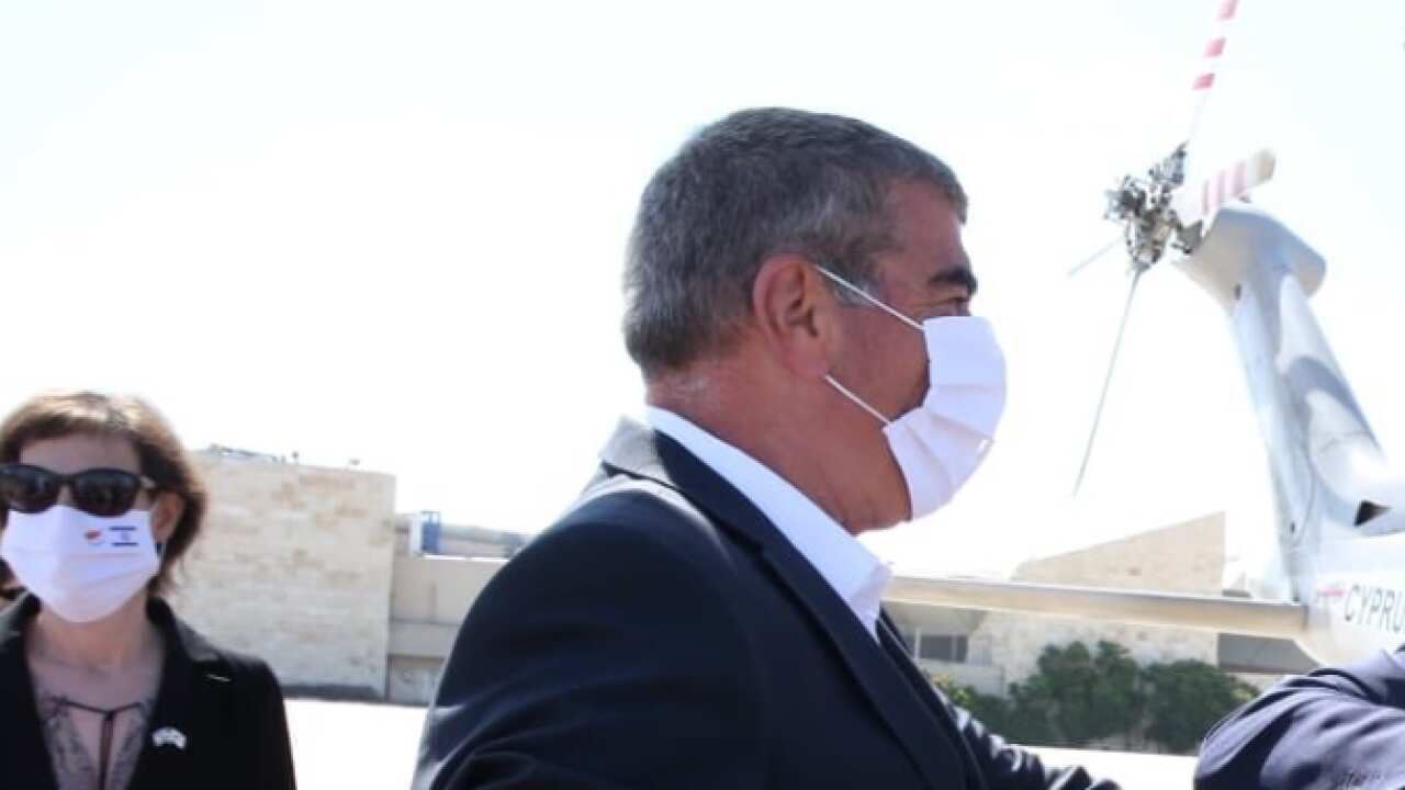 Mr Christodoulides and Mr Ashkenazi bumping elbows.