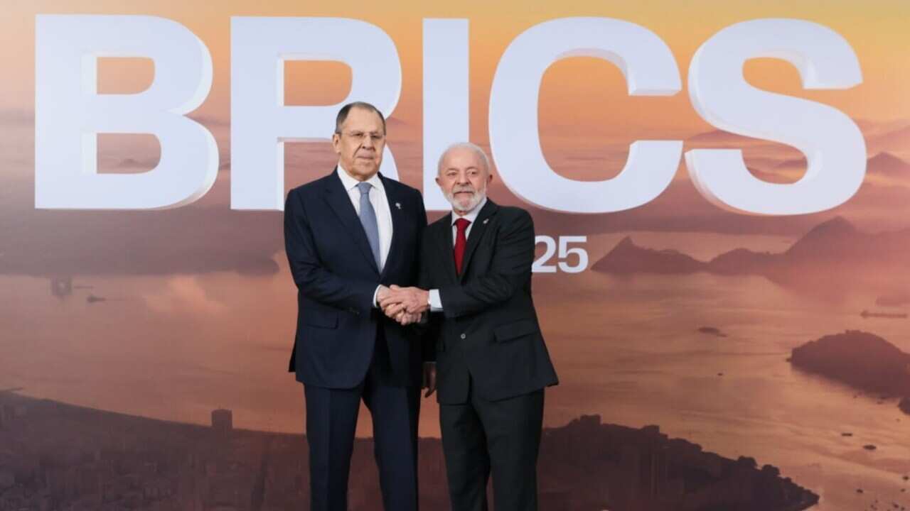 Russia's Minister of Foreign Affairs Sergei Lavrov (L) and Brazil's President Luiz Inacio Lula da Silva shake hands (AAP).jpg