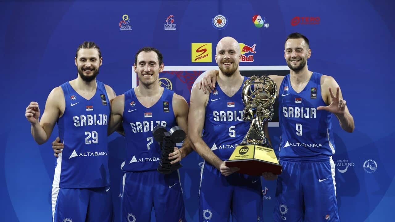 Serbia's players (L-R) Marko Milakovic, Stefan Milivojevic, Nenad Nerandzic and Marko Brankovic celebrate with the trophy after winning the men's FIBA basketball 3x3 Champions Cup 2025