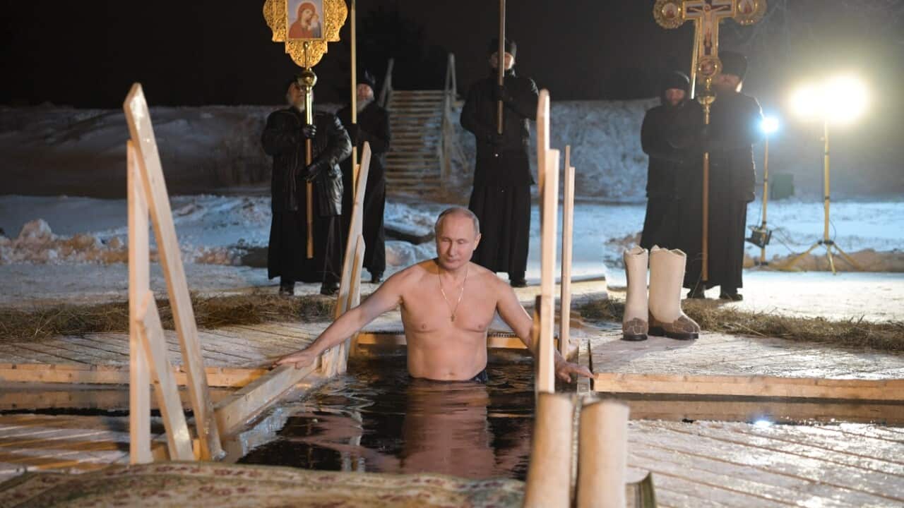 Russian President Vladimir Putin takes a dip in the ice cold water of the lake Seliger during the celebrations of the Orthodox Epiphany holiday