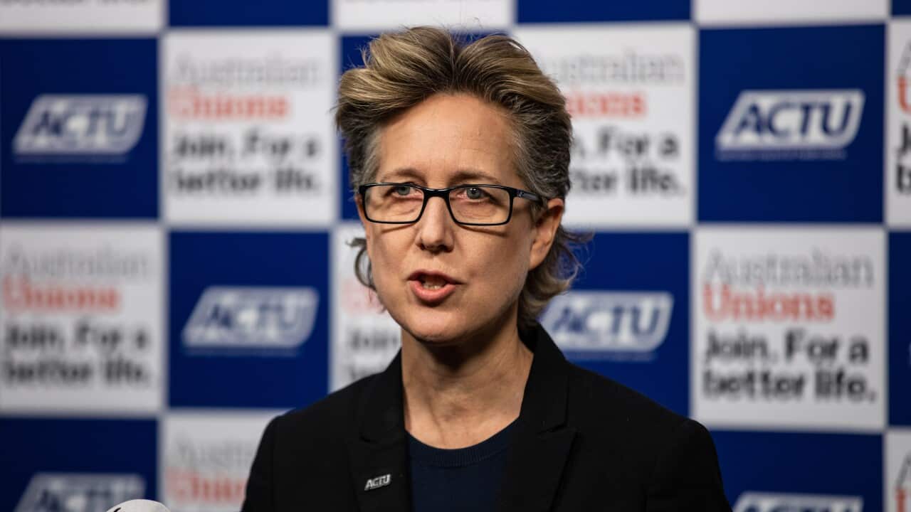 Sally McManus speaking into a microphone