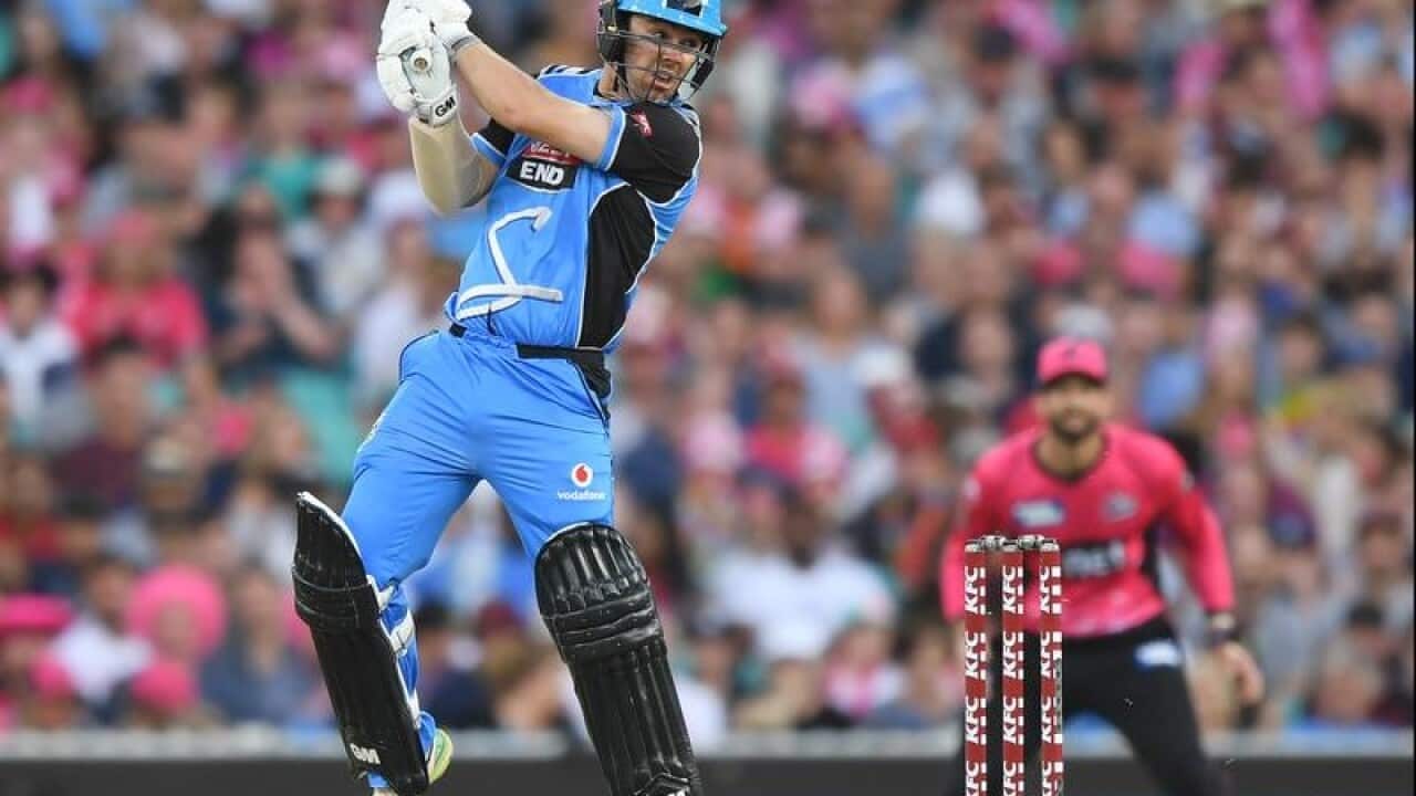 Travis Head of the Strikers hits a four.