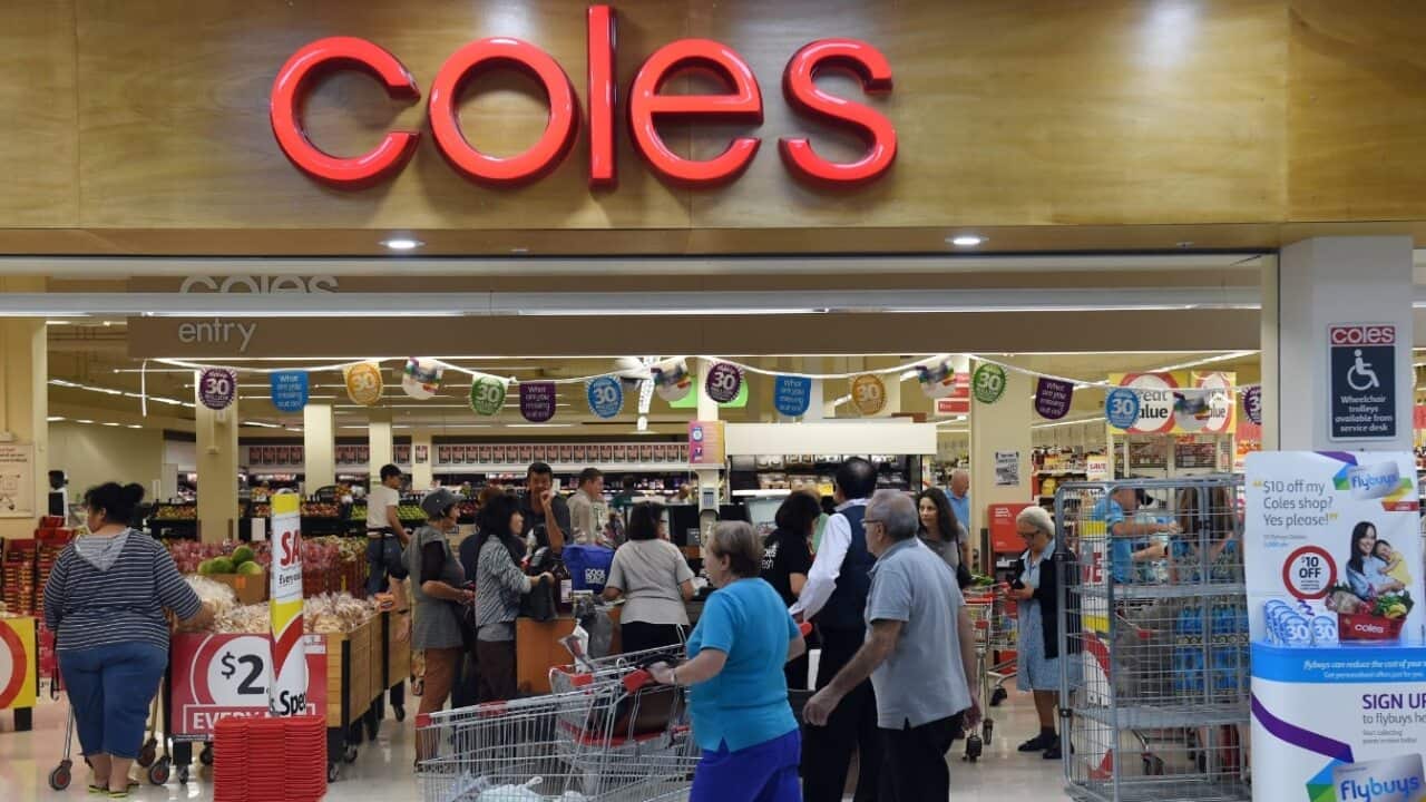 File image of shoppers queuing at the registers at a Coles supermarket in Sydney