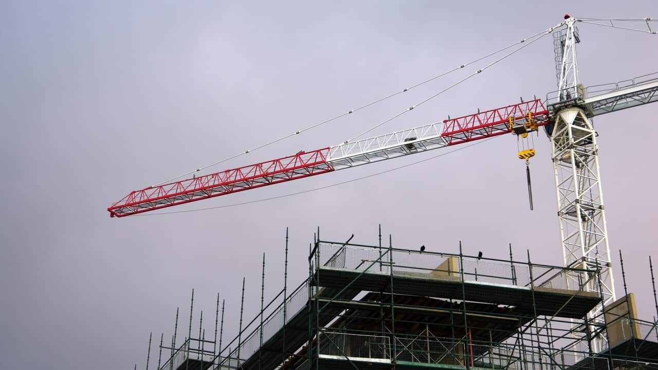 Crane on the construction site of new apartments