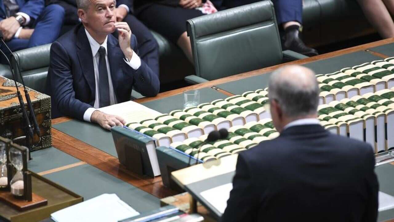 Bill Shorten listens to Scott Morrison
