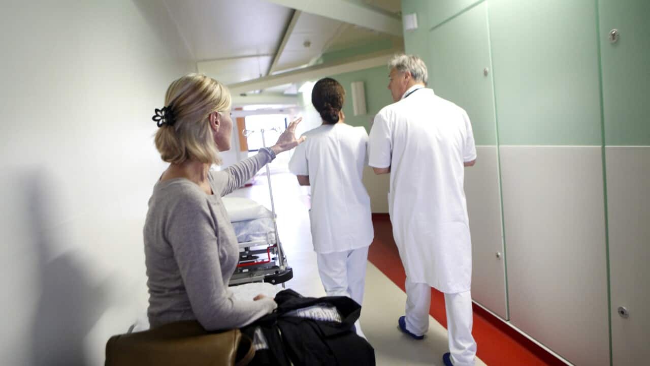 Woman in hospital corridor