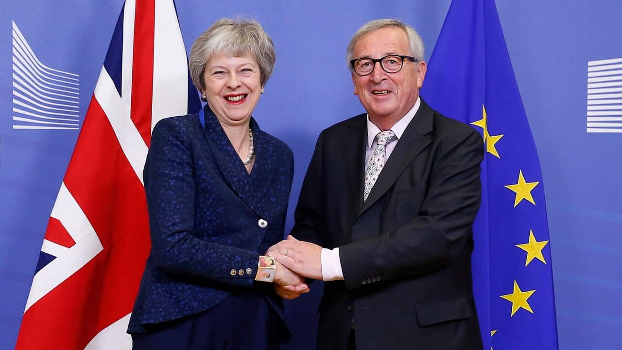 British Prime Minister Theresa May is welcomed by European commission President Jean-Claude Juncker prior to a meeting in Brussels.