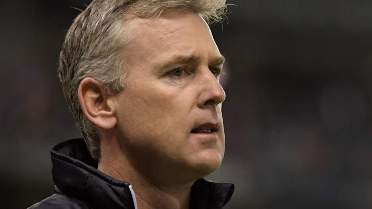 West Coast coach Adam Simpson looks on.