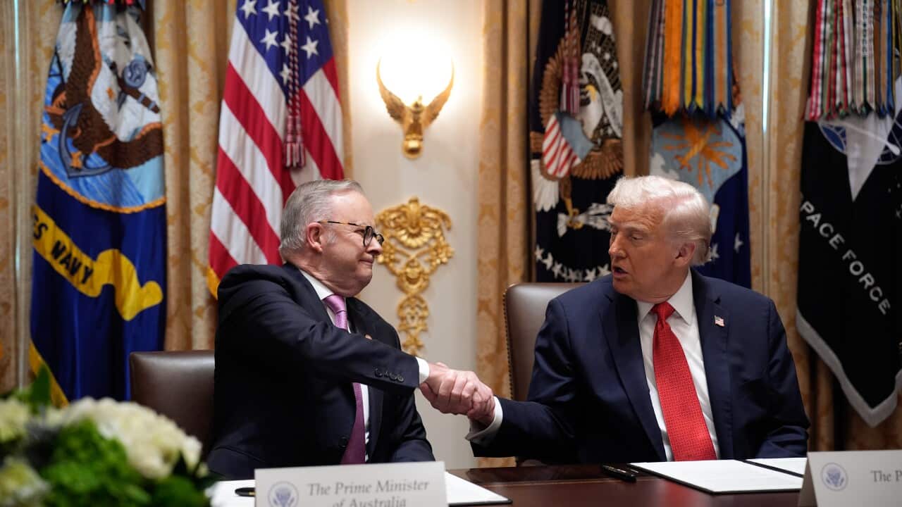 Donald Trump with Anthony Albanese shake hands.