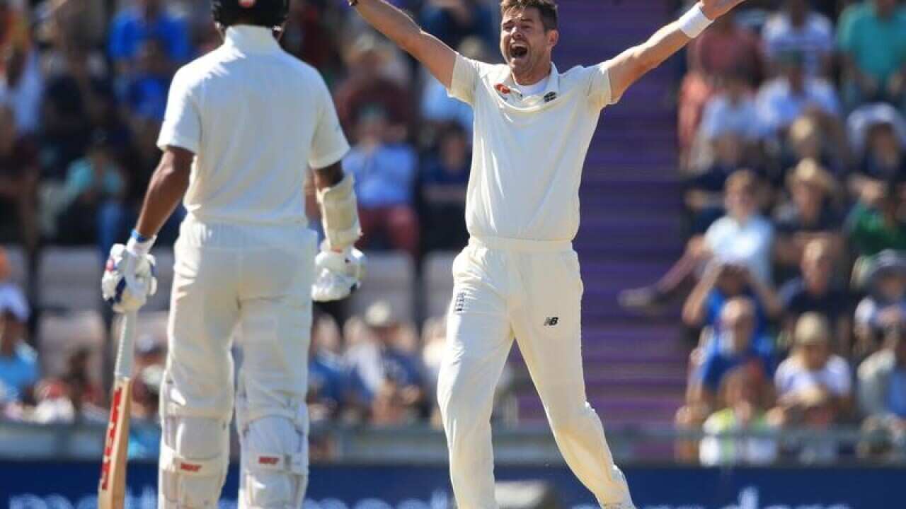 India's Chetshwar Pujara and England's James Anderson