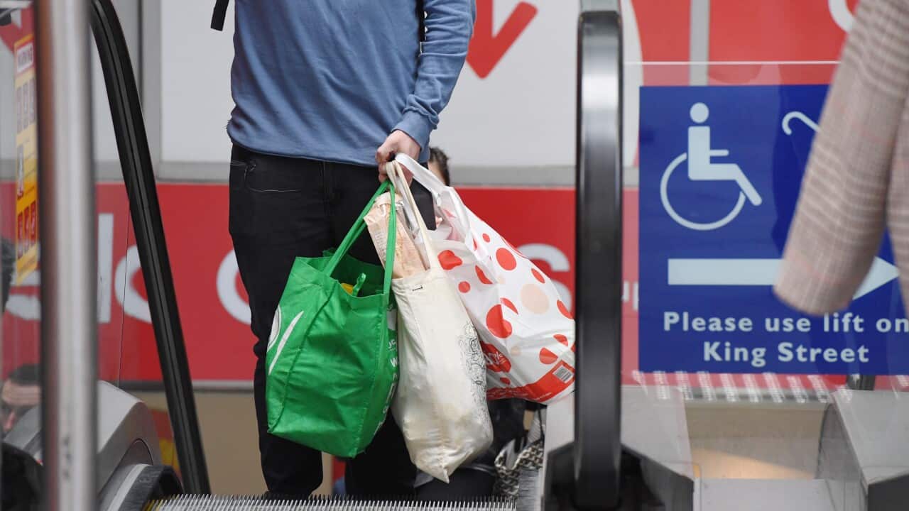 A shopper is seen carrying bags at a Coles Sydney CBD store, Sydney, Monday, July 2, 2018. 