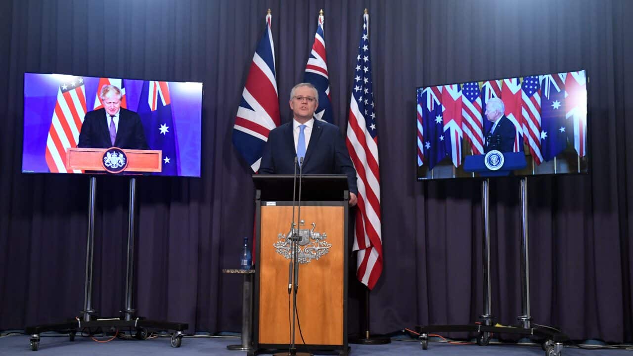 Britains Prime Minister Boris Johnson, Australia's Prime Minister Scott Morrison and US President Joe Biden at a joint press conference in Canberra.