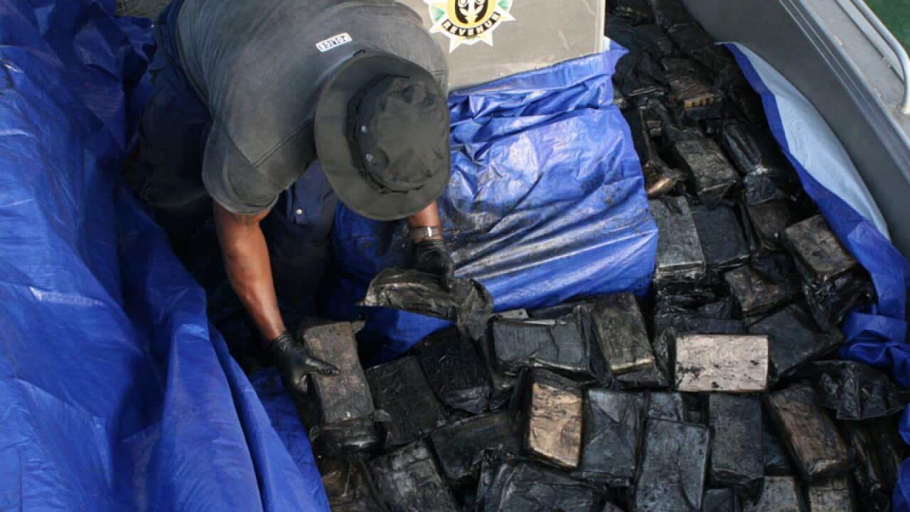 Cocaine is offloaded by police from a yacht in Port Vila.